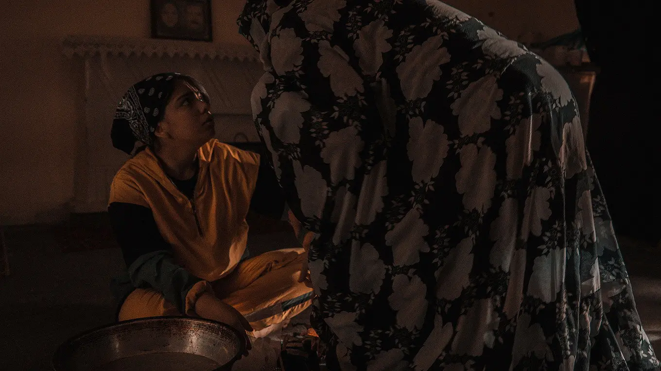 The bride has a doll in her hands backdrop