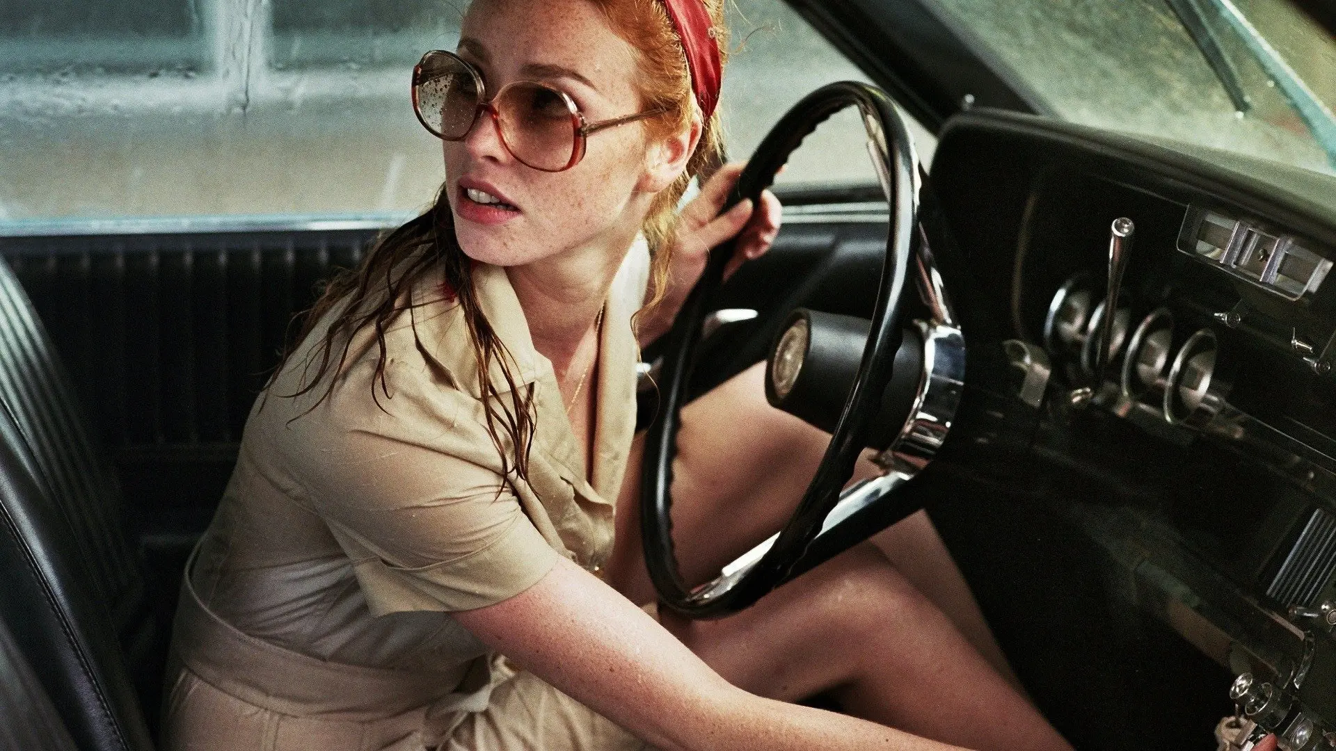 The Lady in the Car with Glasses and a Gun backdrop